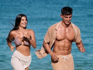 Couple running along the beach at Tamara Cabo